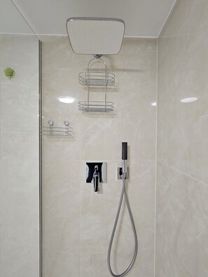 Shower, hair dryer, towels, soap