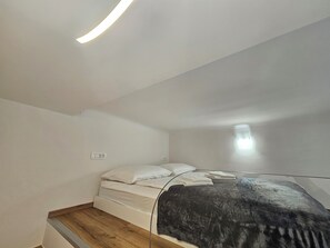 Iron/ironing board, travel crib, free WiFi, bed sheets