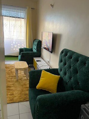 Classic Studio, City View | Living area | 24-inch Smart TV with digital channels - Lux Suites Lakeview Studios  Bamburi (Mombasa)