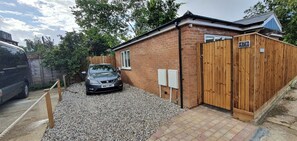 Set amidst a tranquil suburban landscape, this charming home offers a driveway and secure entrance.