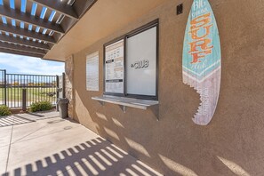 Welcome to the entrance of our resort, where you can enjoy a variety of dining options and surf-inspired activities.