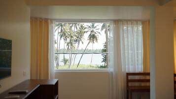 Deluxe Double Room, Partial Ocean View, Corner | Minibar, iron/ironing board, free WiFi, bed sheets