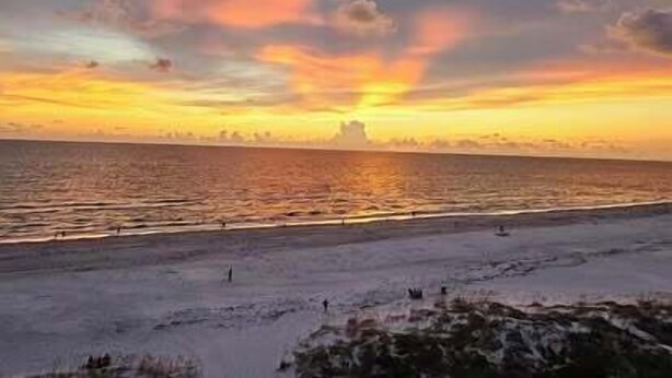 A beach with a sunset.