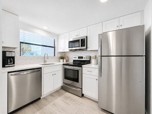 Coffee/tea maker, fridge, microwave, oven
