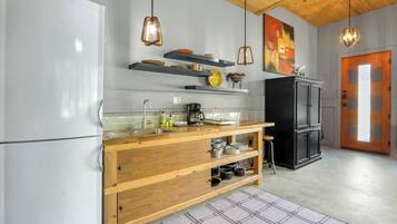 Fridge, microwave, coffee/tea maker, cookware/dishes/utensils