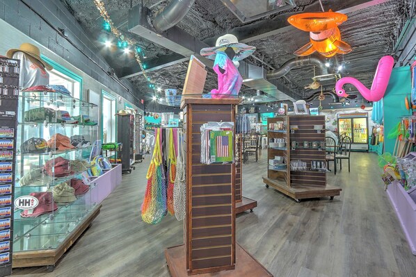 A retail store with various items on display, including hats, bags, and decorative items.