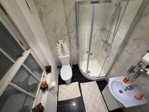 Shower, hair dryer, towels, soap