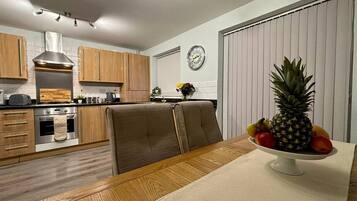 Fridge, microwave, stovetop, cookware/dishes/utensils