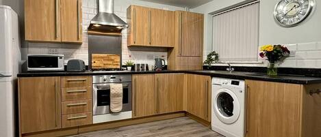 Fridge, microwave, stovetop, cookware/dishes/utensils