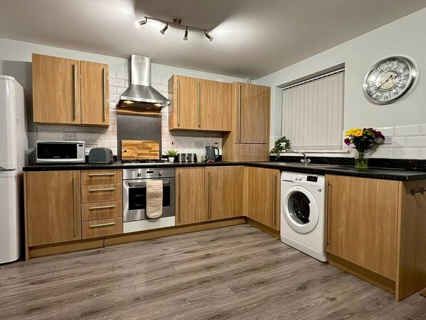Fridge, microwave, stovetop, cookware/dishes/utensils