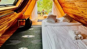 A cozy tent with a bed, a table, and a chair outside. - Papaya Resort Nong Khiaw (Nong Khiaw)
