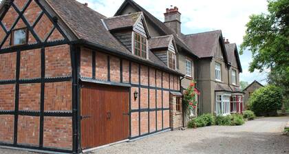 Spacious 9-bedroom house in delightful Whitbourne with great outside space.