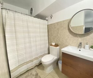 Shower, towels, soap, toilet paper