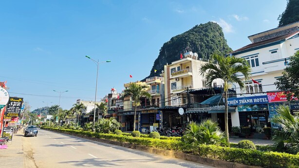 A street view with a hotel named 'THIEN THANH HOTEL' and a massage spa. - The Palm Lodge (Phong Nha)