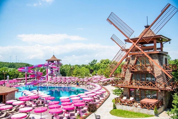 A resort with a large pool, windmill, and water slide. - Windmills Resort (Gorna Malina)