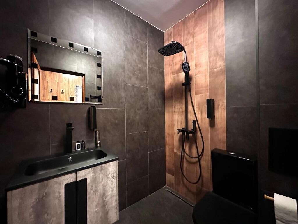 Shower, hair dryer, slippers, towels