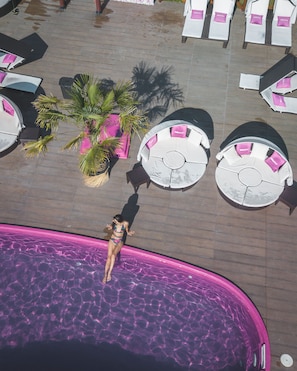 An aerial view of a swimming pool area with lounge chairs and palm trees. - Windmills Resort (Gorna Malina)