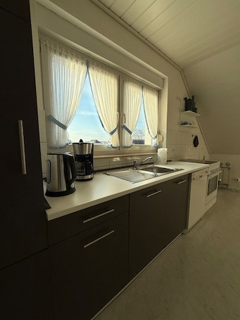Fridge, microwave, oven, stovetop. Cozy vacation apartment with balcony