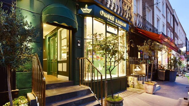 A building with a storefront labeled "The Royal Fragrance."