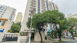 A multi-story building with balconies, a tree in front, and a sign that reads "MOBIA ROYAL LIGHT". - Studio With Balcony Sp-an606 (São Paulo)