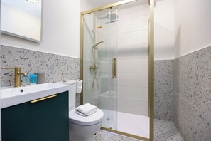 Shower, hair dryer, towels, soap