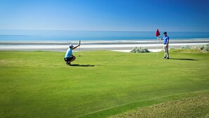 A golf course with a clear view of the ocean in the background. - Sea Esta Villa by Kivoya (Puerto Peñasco)