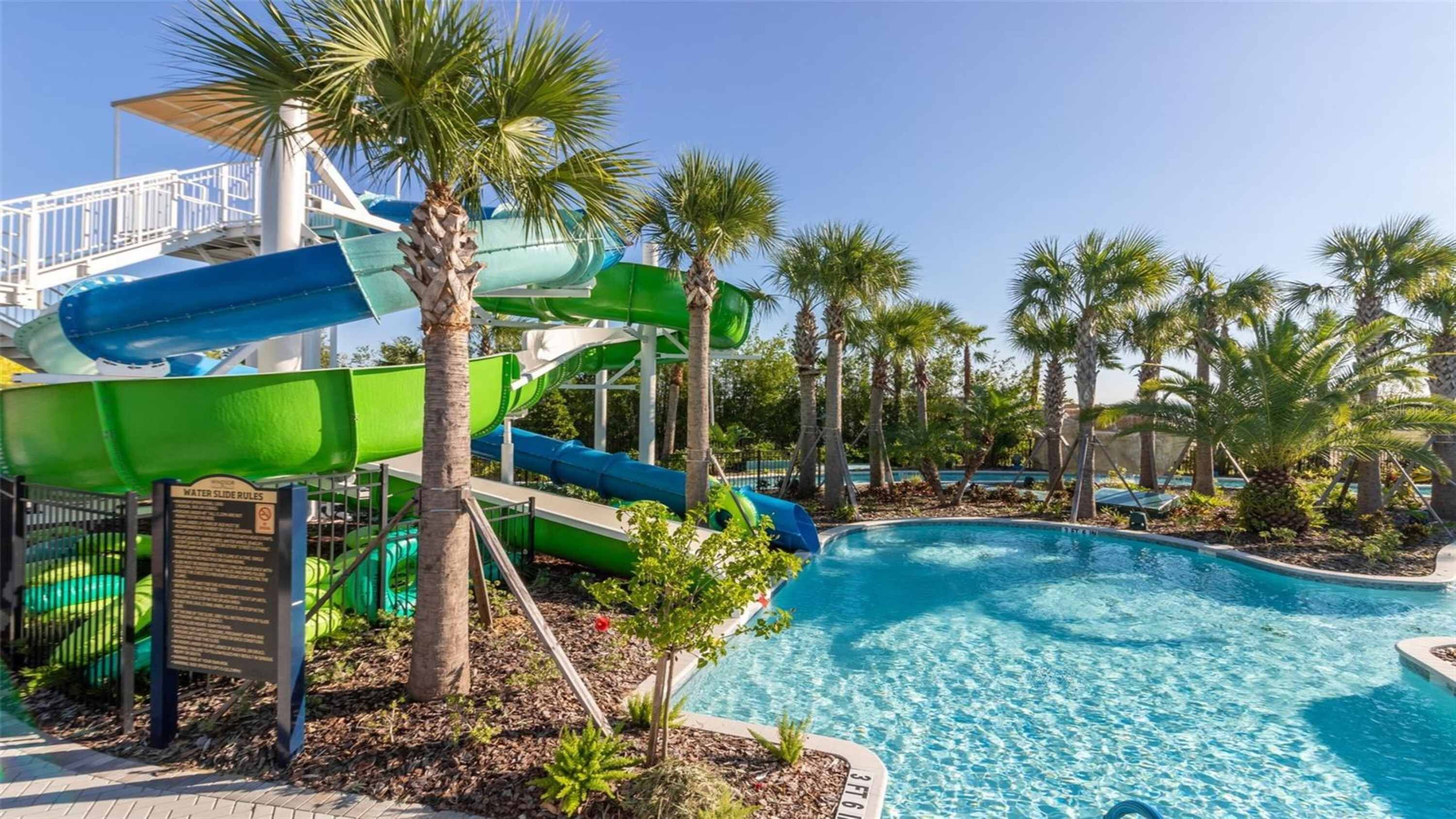 A water park with multiple slides and a pool.