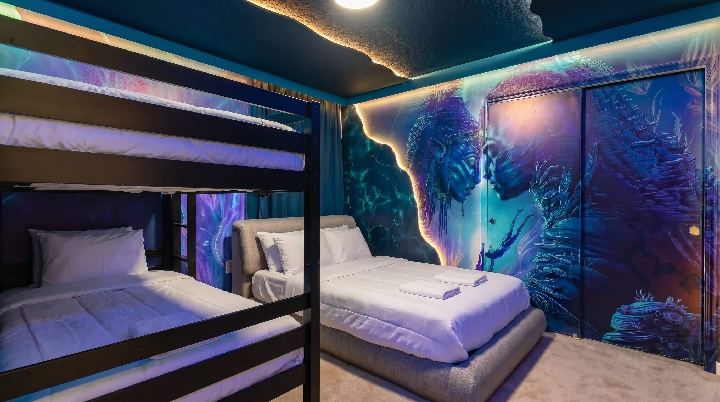 A room with bunk beds, a large mural, and a ceiling light.