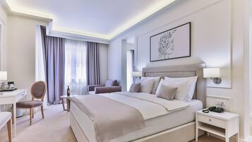 Minibar, desk, laptop workspace, bed sheets