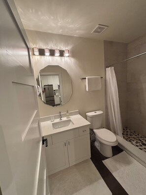 Shower, hair dryer, towels, soap