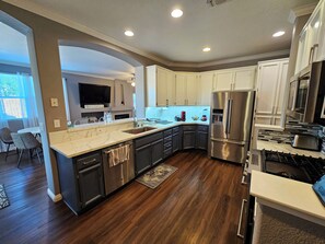 Fridge, microwave, oven, stovetop - Cozy & Convenient: A Clean Home Away from Home with Pool & Heated Spa (Sacramento)
