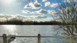A deck with a hot tub, a grassy area, and a view of a lake. - Lake Access, Hot Tub, 4+MBed, 3Bth, Landings, Cotswolds Water Park, Sth Cerney (South Cerney)