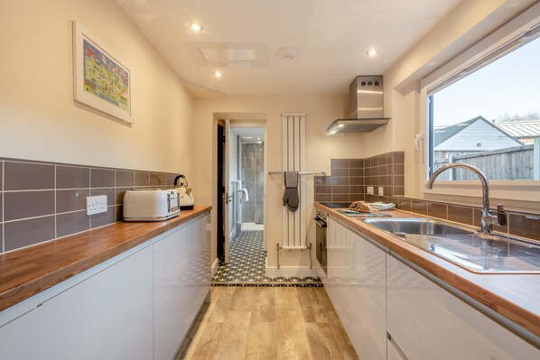 Fridge, microwave, oven, cookware/dishes/utensils