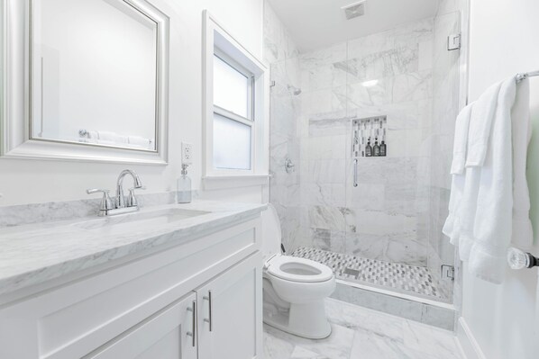 Shower, hair dryer, towels, soap
