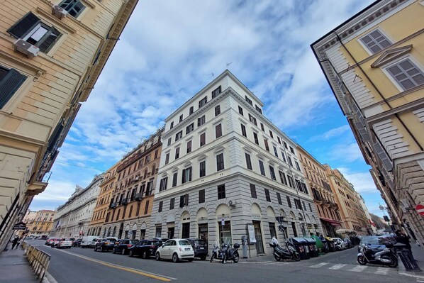 A historic building with a classical architectural style, featuring multiple stories and a prominent corner entrance.