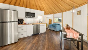 A modern kitchen with stainless steel appliances, white cabinetry, and a wooden ceiling. - Ultimate Group Getaway at Canyon Lake - Sleeps 33! (Canyon Lake)