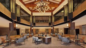 A spacious lobby with a high ceiling, a central chandelier, and multiple seating areas. - Four Points By Sheraton Anshun, Huangguoshu (Anshun)