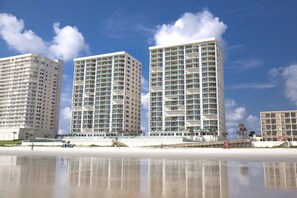 On the beach, sun-loungers, beach towels - Direct Ocean Front Luxury Condo , DiMucci Twin Tower . 2 Bedrooms / 2 Bathrooms. (Daytona Beach)