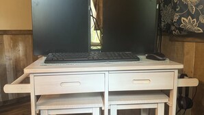 A small, white desk with two open laptop screens, a keyboard, and a mouse. - Peaceful cabin retreat to enjoy all the quiet & beauty nature has to offer. (Mansfield)