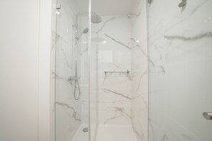 Shower, hair dryer, towels, soap