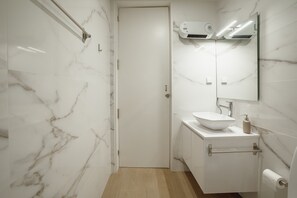 Shower, hair dryer, towels, soap