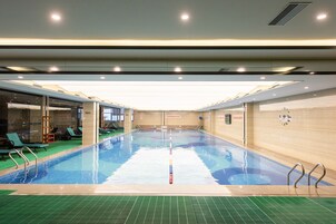 Indoor pool, open 7:00 AM to 10:00 PM, sun loungers, lifeguards on site