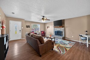 Smart TV, fireplace, table football, books