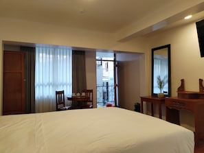 Superior Triple Room, 1 Bedroom | In-room safe, desk, laptop workspace, blackout drapes