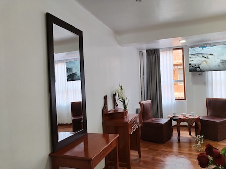 Classic Triple Room | In-room safe, desk, laptop workspace, blackout drapes. Kantu Hotel