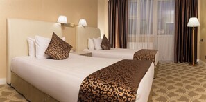 In-room safe, desk, laptop workspace, blackout curtains - Bayangol Hotel (Ulaanbaatar)