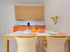 Microwave, high chair, dining tables