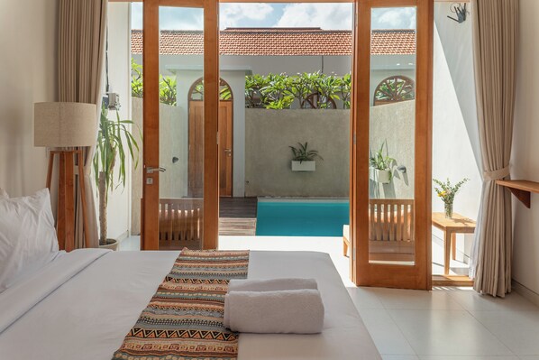 Deluxe Double Room, Pool View | Minibar, in-room safe, blackout curtains, free WiFi