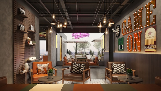 A modern interior with leather sofas, wooden tables, and a city view through large windows.