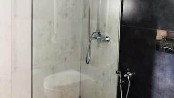 Deluxe Double or Twin Room, Patio | Bathroom | Shower, towels, soap, toilet paper